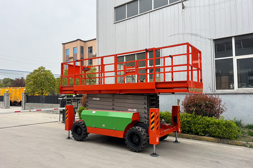 Rough terrain scissor lift on site
